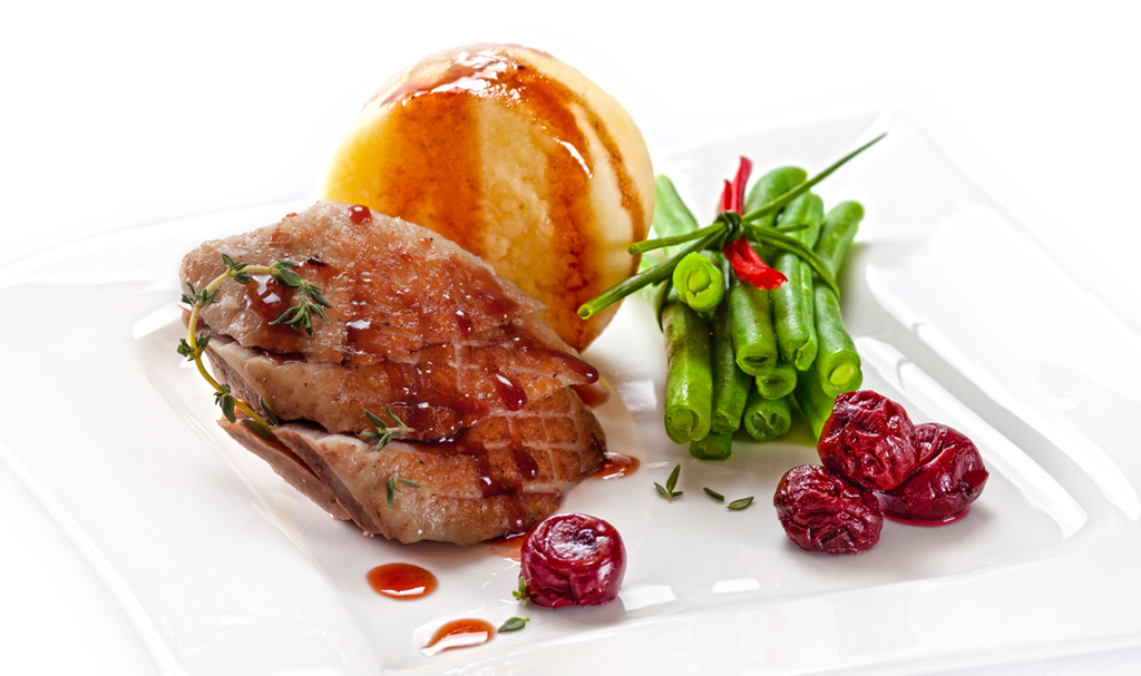 Honey-glazed duck breast. Duck breast with mashed potatoes